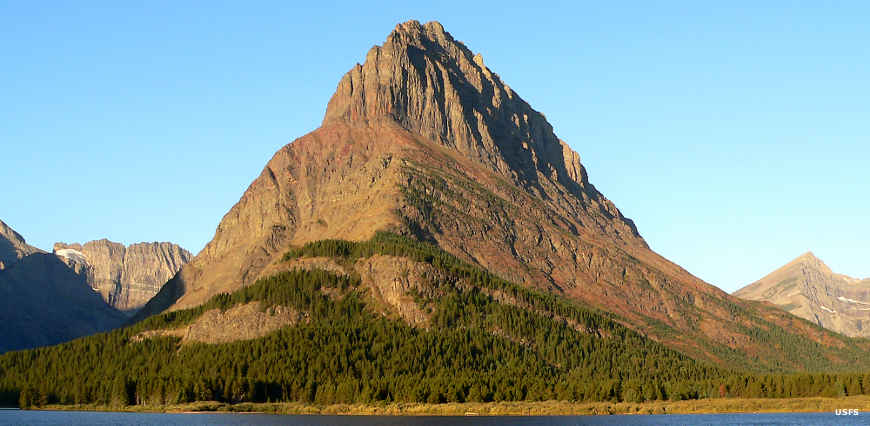 Montana National Park Service Sites: A view of Grinnell Peak at sunrise in Glacier National Park Sunrise on Grinnell Peak, Glacier National Park