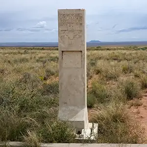 A granite post marking the Dominguez-Escalante Trail Route along the Old Spanish National Historic Trail