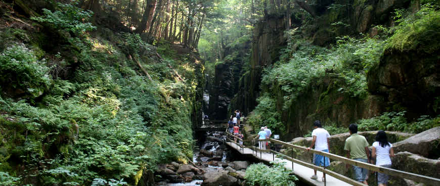 People on the boardwalk through Flume Gorge at Franconia Notch State Park