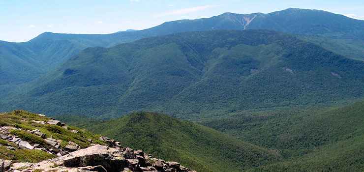 Looking across a forested valley and mountains in Pemigewasset Wilderness