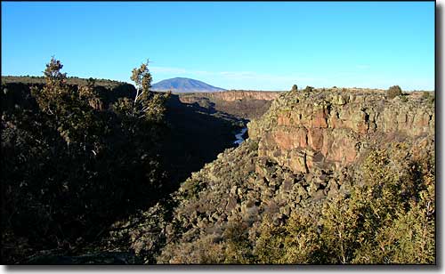 Volcanic bluff rising above the Rio Grande Wild and Scenic River