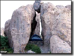 City of Rocks State Park: View of a tent site inside a rock formation Tent site inside a rock formation