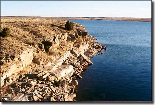 Ute Lake State Park: View of sandstone cliffs along the shoreline of the lake Sandstone cliffs on the shoreline of Ute Lake