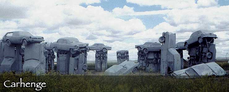 Car bodies are stood on end, partially buried and sometimes stacked on each other for the sculptures at Carhenge