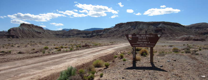 Sign marking entry and mileages at the beginning of the Bull Creek Pass Backcountry Byway