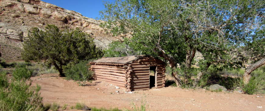 A log cabin beside Crescent Creek