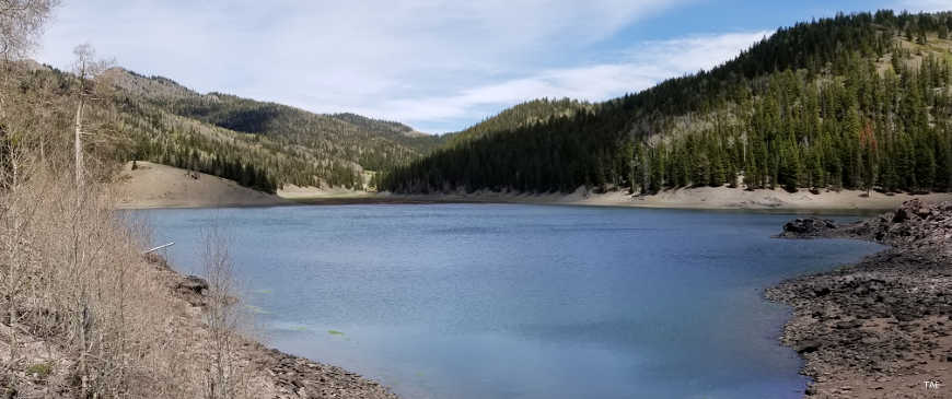 View across a lake at the top of Beaver Canyon