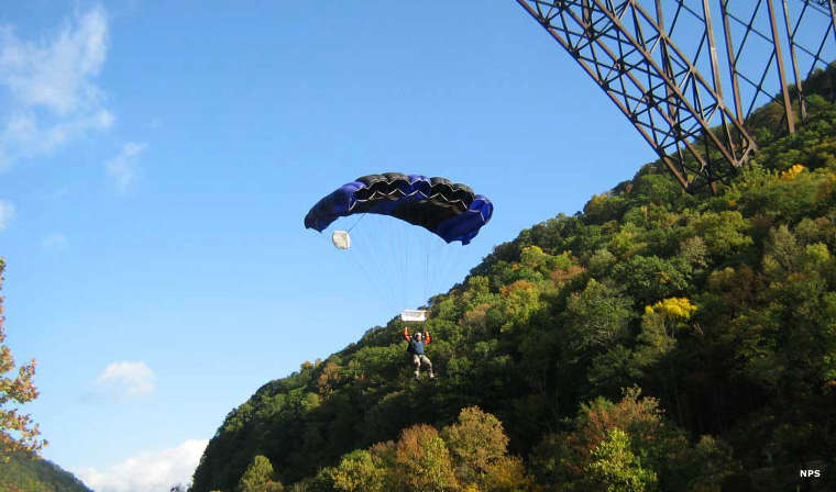 New River Gorge National River: View of a BASE jumper just below New River Gorge Bridge BASE jumper at New River Gorge Bridge