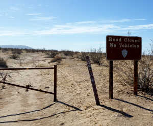 Road closed sign on an old 4WD trail along California Route 62