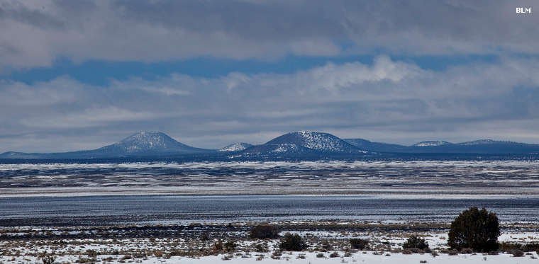 The Chain of Craters, a line of cinder cones across a lava-filled landscape