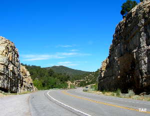 Passing through a cut in the ridge south of Tijeras in Cibola National Forest