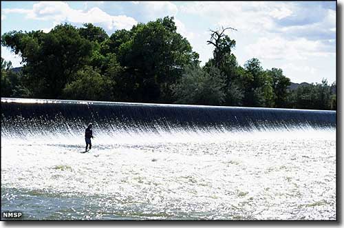 Fisherman below the dam at Percha Dam State Park