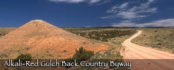 Looking across the multi-colored countryside along the Alkali-Red Gulch Back Country Byway