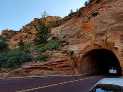 Entrance to the first tunnel, in the face of a multicolored cliff
