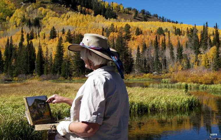An artist working beside the Big Cottonwood Canyon Scenic Byway